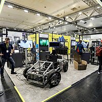 Ein Blick auf das Exponat des InnovationsCampus Mobilität der Zukunft, das innovative Technologien und Konzepte für zukünftige Mobilitätslösungen präsentiert.