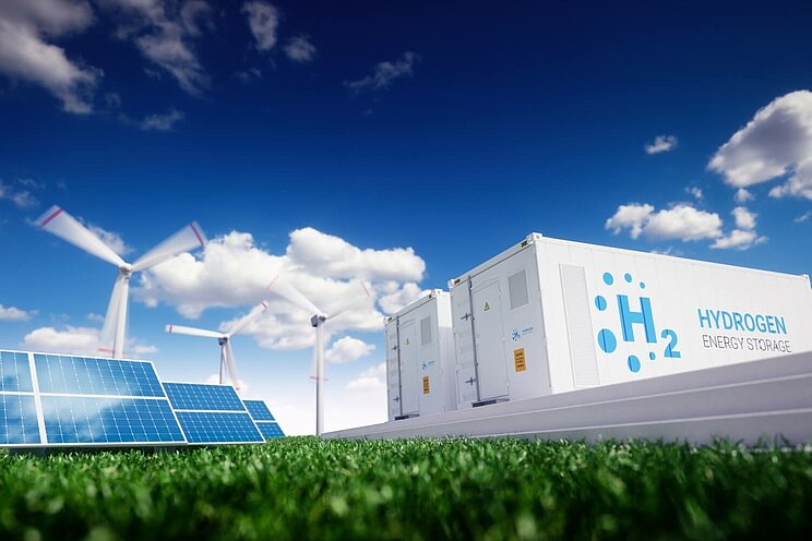 Solarzellen verdeutlichen neben Windrädern und einem Elektrolyseur die Sektorenkopplung