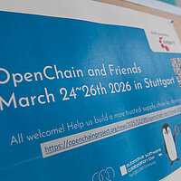 Ein Plaka bei einer Veranstaltung t mit der Aufschrift OpenChain and Friends 2026.